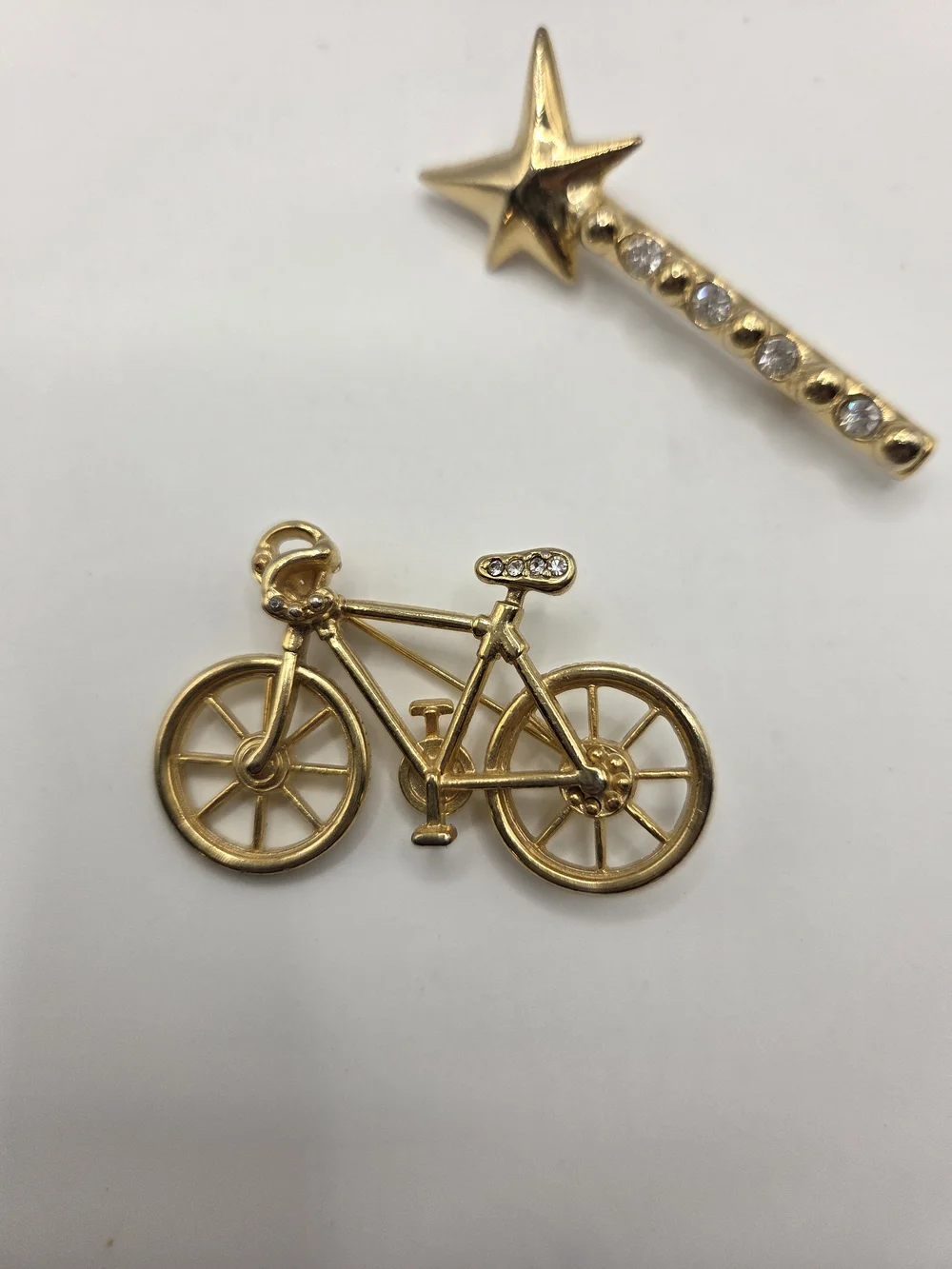 1569. Set Of Two Fun Gold Tone Brooches